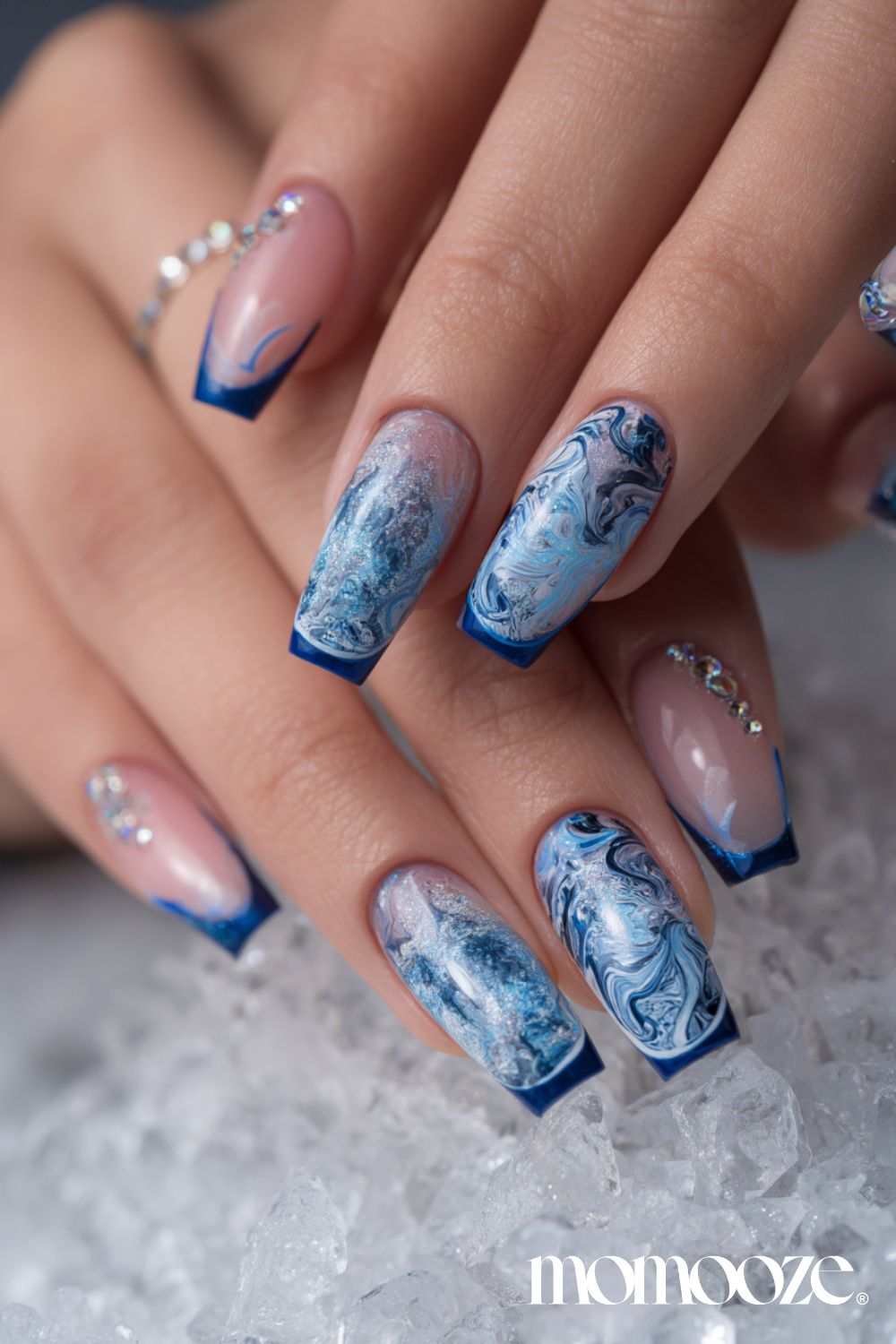 Blue marble French tips with rhinestone accents